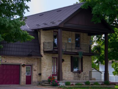 Hy-Grade-Steel-Roof-Metal-Roof-Yellow-Brick-House-Dark-Brown-Roof