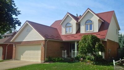 Hy-Grade-Steel-Roofing-System-Metal-Roofing-See-Our-Work-Canners-Brown-metal-roof-brown-bricks-siding