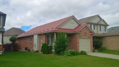 Hy-Grade-Steel-Roofing-System-Metal-Roofing-See-Our-Work-Canners-Brown-metal-roof-red-brick-siding