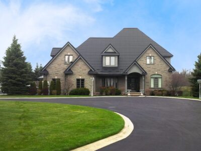 Hy-Grade-Steel-Roofing-System-Metal-Roofing-See-Our-Work-Slate-Grey-large green grass-3-story-home-with-beige-bricks