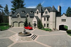 Hy-Grade-Steel-Roofing-System-Metal-Roofing-See-Our-Work-Slate-Grey-Large-3-story-home-red-sports-car-in-foreground