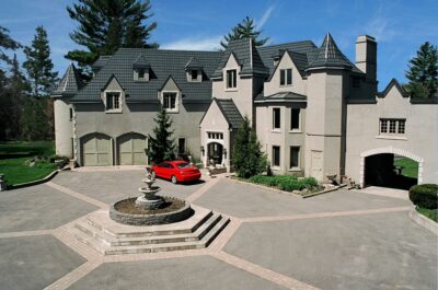 Hy-Grade-Steel-Roofing-System-Metal-Roofing-See-Our-Work-Slate-Grey-Large-3-story-home-red-sports-car-in-foreground