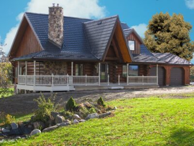 Hy-Grade Steel Roof Deep Log House Dark Brown-Roof. Blue sky can be seen in the background